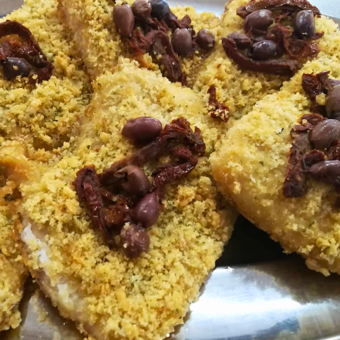 Filetti di persico accompagnati da sedano gratinato